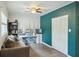 Bright bedroom featuring wood floors, a desk, sofa, and ample storage space at 158 Whippoorwill Dr, Summerville, SC 29483