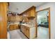 Kitchen with wooden cabinets, stone backsplash, stainless steel range, and butcher block countertops at 158 Whippoorwill Dr, Summerville, SC 29483
