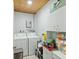 Functional laundry room with washer, dryer, cabinets, and storage at 158 Whippoorwill Dr, Summerville, SC 29483