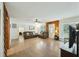 Spacious living room featuring hardwood floors, neutral walls, a ceiling fan, and natural light from the windows at 158 Whippoorwill Dr, Summerville, SC 29483