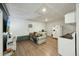 Inviting living room with wood floors, sofa, and kitchenette at 158 Whippoorwill Dr, Summerville, SC 29483