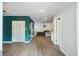 Cozy living room with laminate flooring, closet, tv, and sectional sofa at 158 Whippoorwill Dr, Summerville, SC 29483