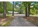 Secluded property featuring a large yard with trees and a long gravel driveway at 158 Whippoorwill Dr, Summerville, SC 29483
