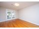 Cozy bedroom featuring wood floors and French doors leading to an outdoor patio at 1707 Sharon Ave, Charleston, SC 29407