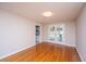 Sunlit bedroom with gleaming wood floors and easy access to the outdoor patio through glass doors at 1707 Sharon Ave, Charleston, SC 29407