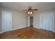 Spacious bedroom featuring hardwood floors, ceiling fan and convenient closet storage at 1707 Sharon Ave, Charleston, SC 29407