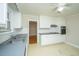 Functional kitchen features white cabinetry, gray countertops, and essential appliances at 1707 Sharon Ave, Charleston, SC 29407
