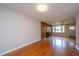 Bright living room with hardwood floors, fireplace, and large windows for natural light at 1707 Sharon Ave, Charleston, SC 29407
