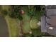 Lush backyard features a seating area and firepit area, complemented by mature trees and landscaping at 187 Ithecaw Creek St, Daniel Island, SC 29492