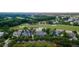Expansive aerial shot showcasing homes surrounded by a golf course and a tranquil pond at 187 Ithecaw Creek St, Daniel Island, SC 29492