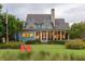 Expansive backyard with manicured lawn, perfect for outdoor activities and relaxation in style at 187 Ithecaw Creek St, Daniel Island, SC 29492