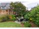 Inviting backyard with outdoor seating area nestled among lush greenery, perfect for relaxing and entertaining guests at 187 Ithecaw Creek St, Daniel Island, SC 29492