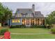 Stunning home exterior with a well-manicured lawn, a covered patio, and beautiful landscaping enhancing its curb appeal at 187 Ithecaw Creek St, Daniel Island, SC 29492