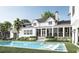 Stunning backyard features a luxurious pool and outdoor living area with lush landscaping at 187 Ithecaw Creek St, Daniel Island, SC 29492