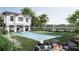 Beautiful backyard features a modern pool, patio area, and outdoor seating near the fire pit at 187 Ithecaw Creek St, Daniel Island, SC 29492