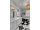 Luxurious bathroom with black and white tile, dual vanity, and soaking tub at 187 Ithecaw Creek St, Daniel Island, SC 29492