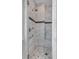 Modern bathroom shower with marble surround and a rain shower head at 187 Ithecaw Creek St, Daniel Island, SC 29492