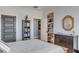 Bedroom with a bookcase, dresser and rope mirror at 187 Ithecaw Creek St, Daniel Island, SC 29492