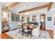 Beautiful dining room with decorative chandelier, exposed beams, and hardwood flooring at 187 Ithecaw Creek St, Daniel Island, SC 29492
