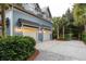 Charming home exterior with a two-car garage, well-maintained landscaping, and a spacious driveway with ample parking at 187 Ithecaw Creek St, Daniel Island, SC 29492