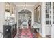 Inviting foyer with hardwood floors, elegant decor, and arched doorways at 187 Ithecaw Creek St, Daniel Island, SC 29492