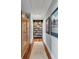 Hallway featuring hardwood floors and a full bookcase at 187 Ithecaw Creek St, Daniel Island, SC 29492