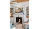 Living room featuring fireplace, bookshelves, and stylish decor at 187 Ithecaw Creek St, Daniel Island, SC 29492