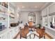 Bright office with custom built-ins, hardwood floors, and a decorative mirror at 187 Ithecaw Creek St, Daniel Island, SC 29492