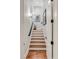 Stairway featuring hardwood steps and modern fixtures at 187 Ithecaw Creek St, Daniel Island, SC 29492