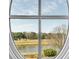 Beautiful view of the golf course through the round window at 187 Ithecaw Creek St, Daniel Island, SC 29492
