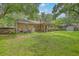 Home with a backyard featuring a patio and storage shed amidst mature trees at 204 Pointer Dr, Summerville, SC 29485