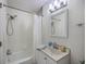 Bathroom with shower tub combination with white shower curtain and updated sink at 204 Pointer Dr, Summerville, SC 29485