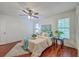 Bright bedroom features wood floor, a ceiling fan, and natural light from the windows at 204 Pointer Dr, Summerville, SC 29485