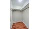 An empty closet area with laminate wood flooring and a single shelf at 204 Pointer Dr, Summerville, SC 29485