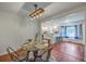 Cozy dining room with modern lighting, an attractive table, and an open view to the kitchen at 204 Pointer Dr, Summerville, SC 29485
