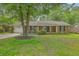 Charming brick home with a well-manicured lawn and mature shade tree at 204 Pointer Dr, Summerville, SC 29485