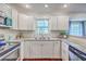 Bright kitchen featuring granite counters, stainless steel appliances, and white subway tile backsplash at 204 Pointer Dr, Summerville, SC 29485