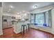 Bright kitchen featuring stainless steel appliances, white cabinets, bar seating, and a window seat at 204 Pointer Dr, Summerville, SC 29485