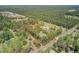 Aerial view highlighting the expansive wooded lot and property layout at 209 Cheyenne Rd, Summerville, SC 29483