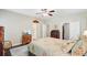 An inviting bedroom features a patterned bedspread, hardwood floors, and views to adjacent rooms at 209 Cheyenne Rd, Summerville, SC 29483