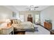 A calming bedroom showcases hardwood floors, natural light, complemented by a cozy area rug at 209 Cheyenne Rd, Summerville, SC 29483