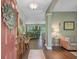 Inviting home foyer featuring wood floors and open view to the kitchen and living areas at 209 Cheyenne Rd, Summerville, SC 29483