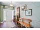 Bright home entryway with hardwood floors, decorative mirror, and a bench at 209 Cheyenne Rd, Summerville, SC 29483