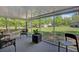 Inviting lanai featuring comfortable seating and a picturesque view of the expansive yard at 209 Cheyenne Rd, Summerville, SC 29483