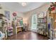A well-lit room equipped with a painting station and ample storage, perfect for artistic endeavors at 209 Cheyenne Rd, Summerville, SC 29483