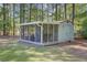 Cozy screened shed featuring comfortable seating, perfect for enjoying the outdoors in a protected space at 209 Cheyenne Rd, Summerville, SC 29483