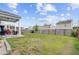Spacious backyard featuring a covered patio, fenced yard, and ample green space at 212 Rubles Ln, Moncks Corner, SC 29461