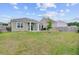 Well-maintained backyard with a covered patio, seating area, and a fire pit at 212 Rubles Ln, Moncks Corner, SC 29461