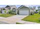 Charming single-story home featuring a well-maintained lawn and attached two-car garage at 212 Rubles Ln, Moncks Corner, SC 29461
