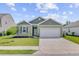 Charming home with manicured lawn, attached garage and delightful curb appeal at 212 Rubles Ln, Moncks Corner, SC 29461